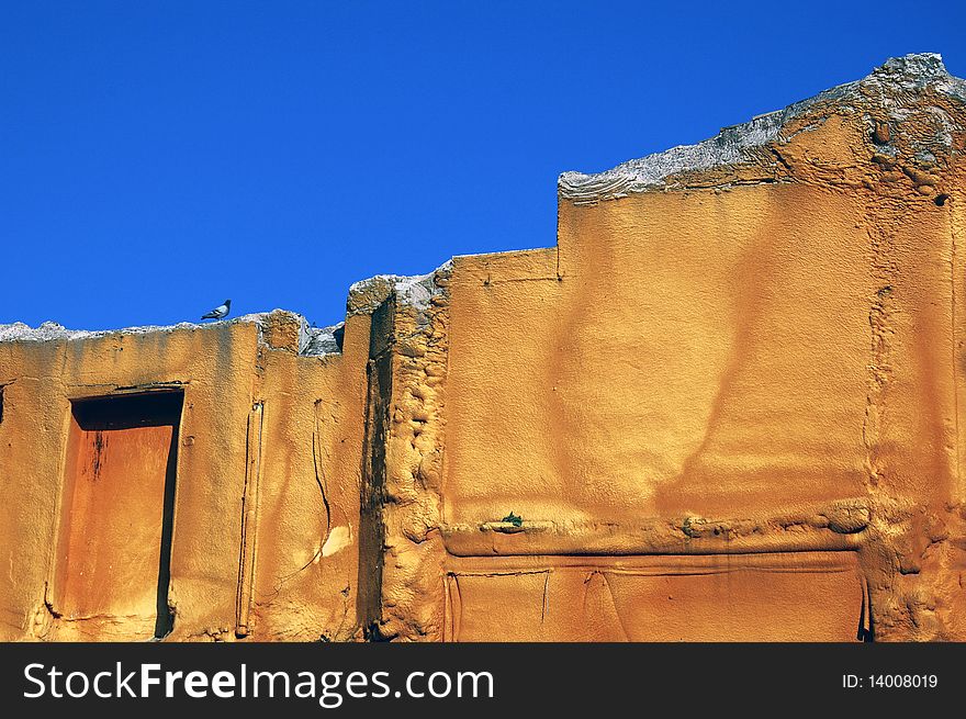 Contrast blue and ocher in a building with a dove. Contrast blue and ocher in a building with a dove