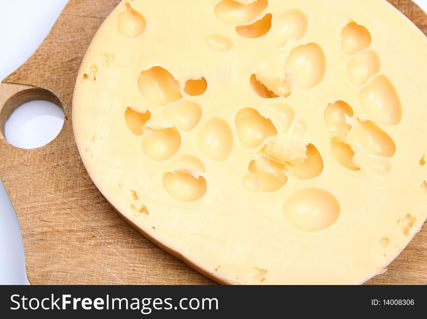 Cheese on a wooden board in close up