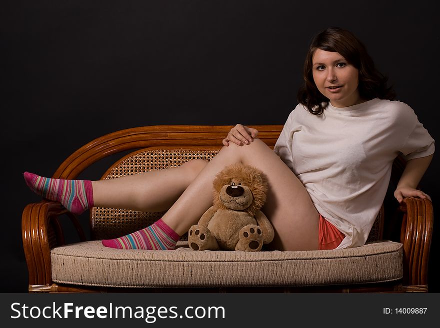 A girl holds a yellow toy-lion. A girl holds a yellow toy-lion