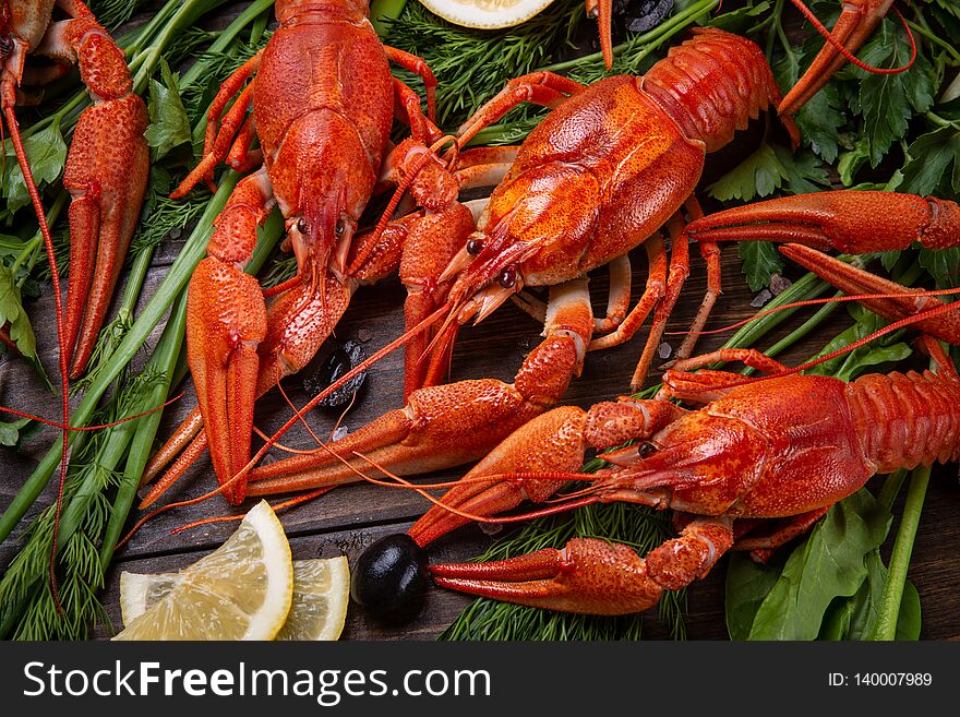 Crayfish. Red boiled crawfishes on table in rustic style, closeup. Lobster closeup.