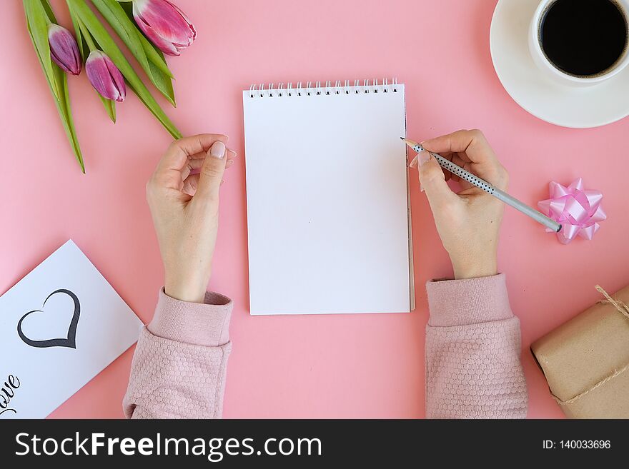 Styled Feminine Flatlay With Pink Tulip Flowers, Notebook, Cup Of Coffee. Copy Space For Text.