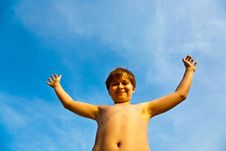Young Boy Rises His Arms At The Beach Royalty Free Stock Image Young Boy Rises His Arms At The Beach Royalty Free Stock Image