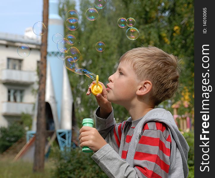 Boy   soap bubbles, play  outdoors