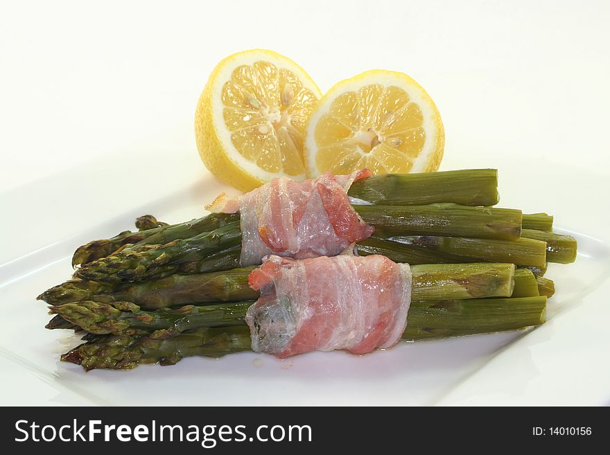 Green asparagus with ham in the oven. Green asparagus with ham in the oven