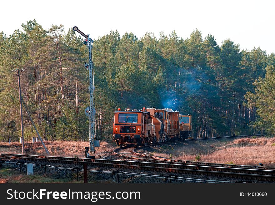 Railway heavy duty machines train entering the station