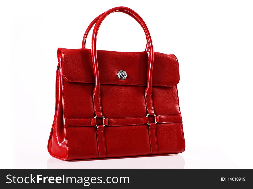 Red handbag in the studio on a white background. Red handbag in the studio on a white background.