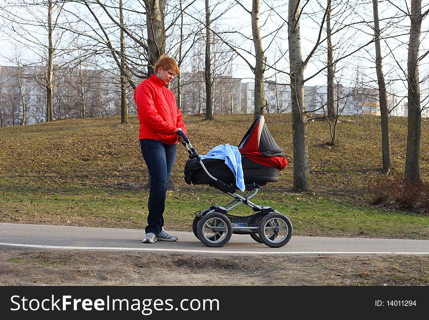 Mother Walking in the park with a sidecar