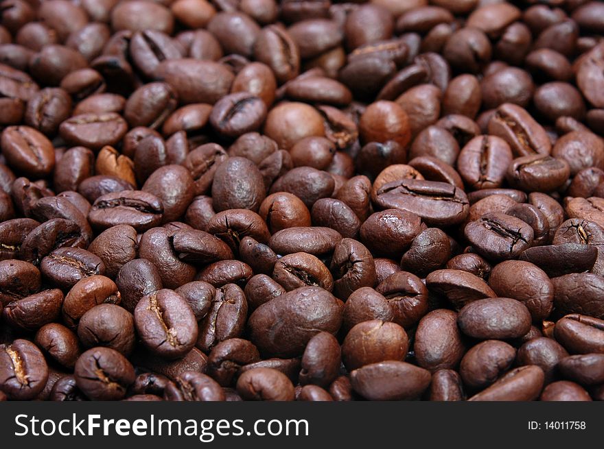 Fresh black coffee bean with a blurry background. Fresh black coffee bean with a blurry background