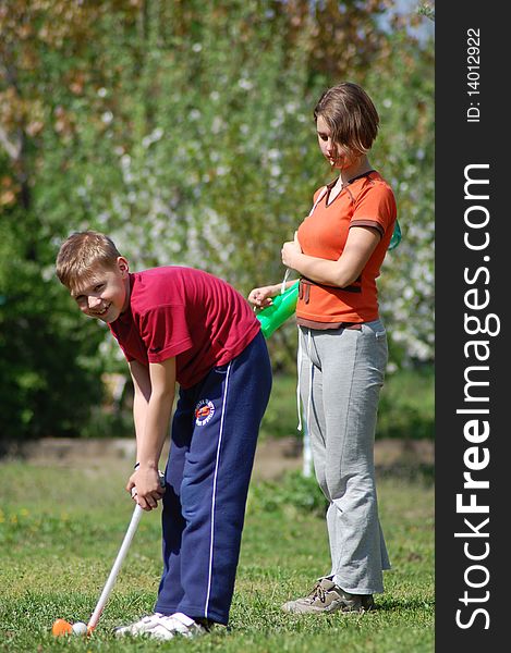 Fullbody young man outdoors playing golf. Fullbody young man outdoors playing golf