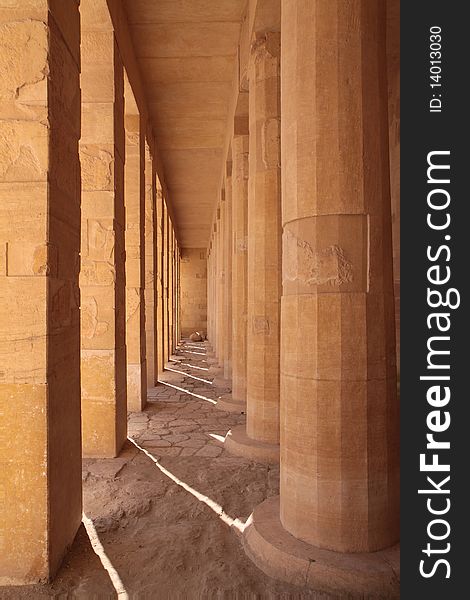 Ancient stone square and round columns in Egyptian temple