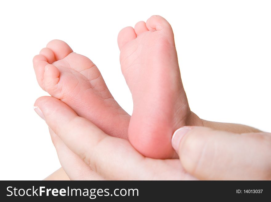 Heels of the baby in hands of mother. Heels of the baby in hands of mother
