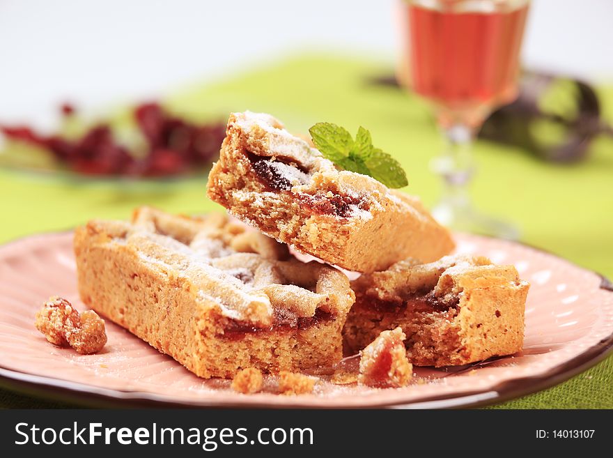 Small shortbread cakes filled with jam - closeup. Small shortbread cakes filled with jam - closeup