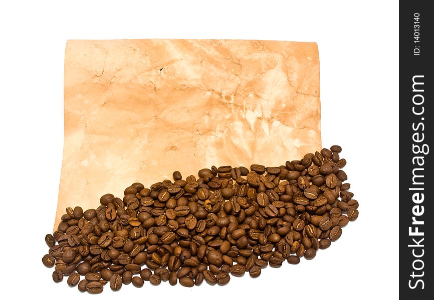 Grains of coffee and old paper on a white background