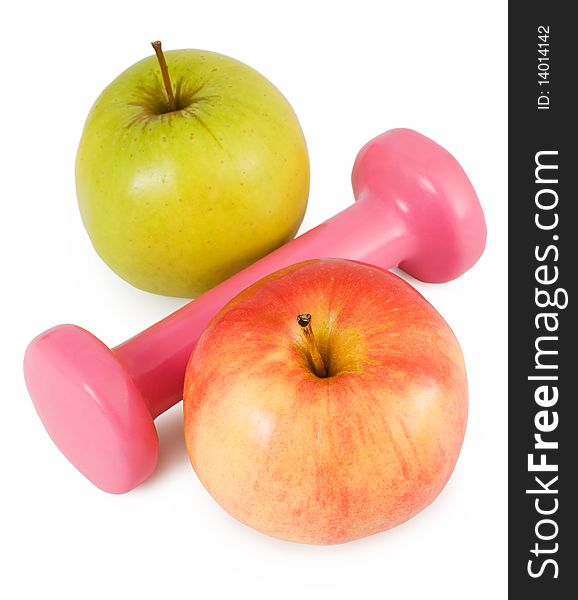 Pink dumbbells and two apples on a white background in percent shape. Pink dumbbells and two apples on a white background in percent shape