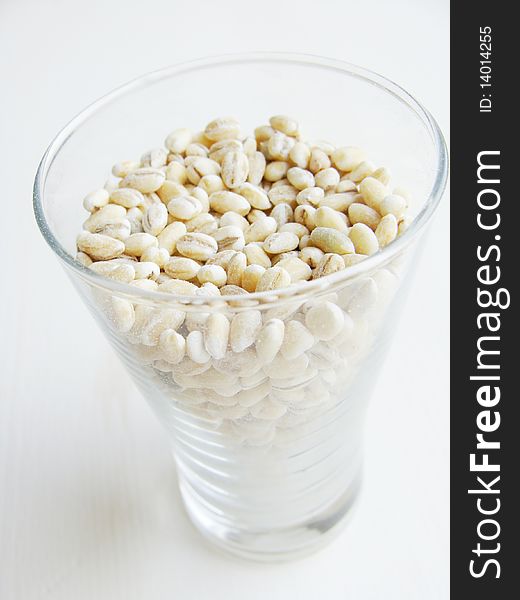 Pearl barley in a glass close up