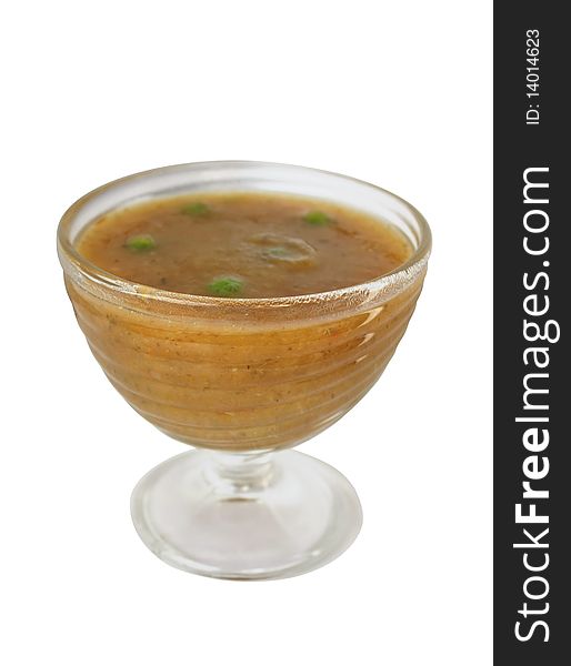 Vegetable soup puree in a glass dish on a white background