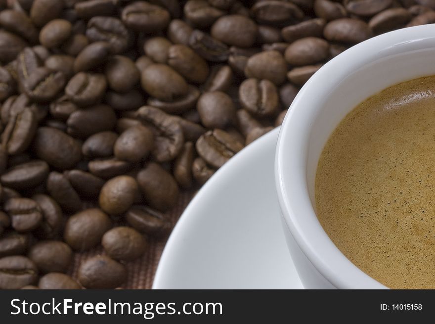 Coffee cup closeup with coffee beans. Coffee cup closeup with coffee beans