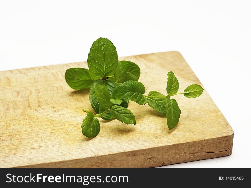 Fresh mint leaf on the wooden board
