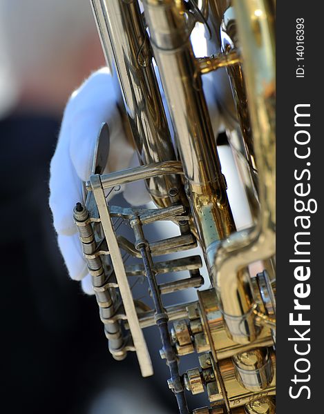 Detail of a musician with brass instrument