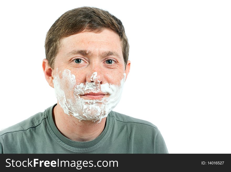 The portrait of the man with a shaving foam on the face. The portrait of the man with a shaving foam on the face