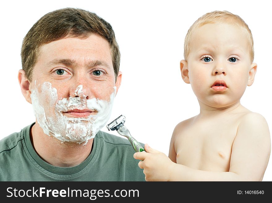 Cute little boy shaving his father - on white background. Cute little boy shaving his father - on white background