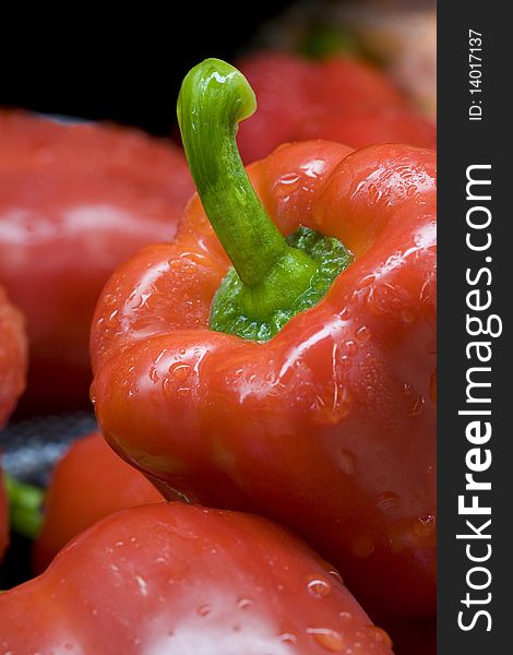 A close up of a brightly colored red bell pepper. A close up of a brightly colored red bell pepper.