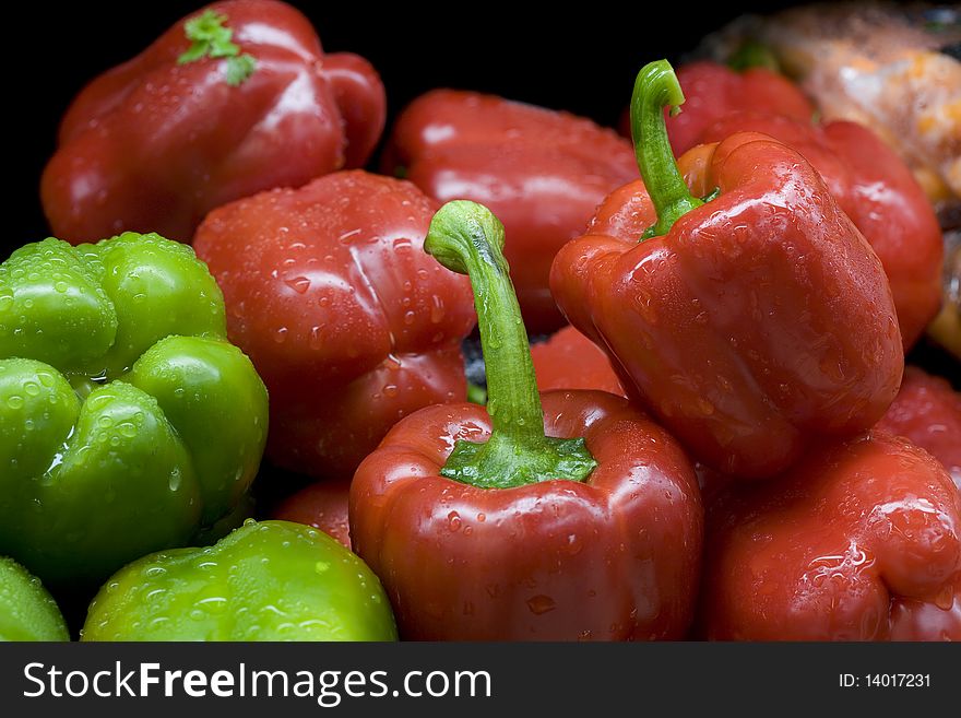 Close up of red and green bell peppers.