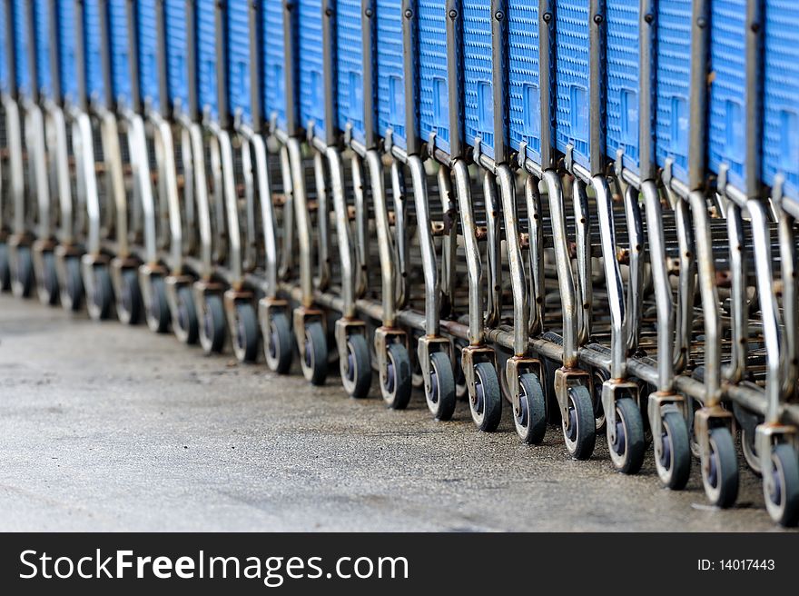 Many shopping carts in the rain