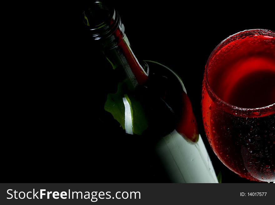 Red wine on black background