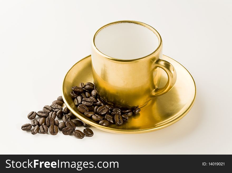 Empty coffee cup with beans on white. Empty coffee cup with beans on white