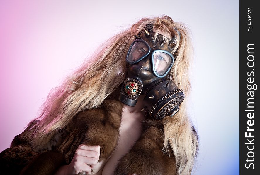 Young woman in the gas mask