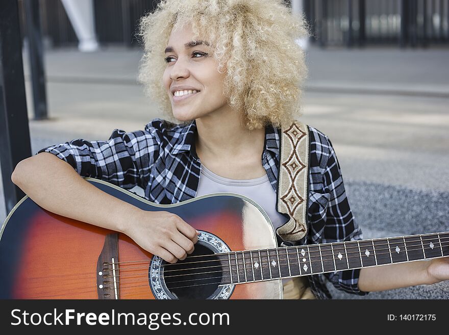 Cheerful Girl Playing The Guitar The Street