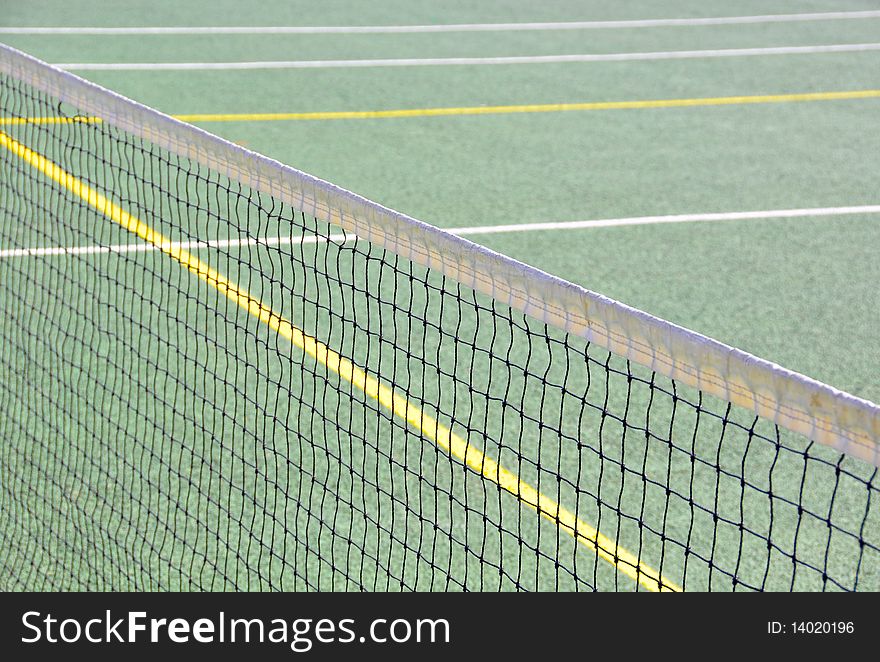 Closeup of tennis net on empty court