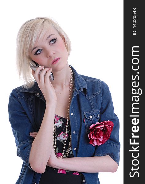 Photograph showing pretty blond girl using mobile phone isolated against white. Photograph showing pretty blond girl using mobile phone isolated against white