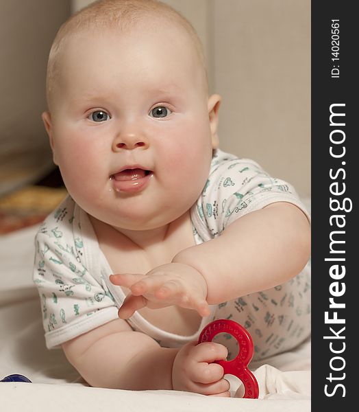 Portrait of a baby girl (9 months) at home