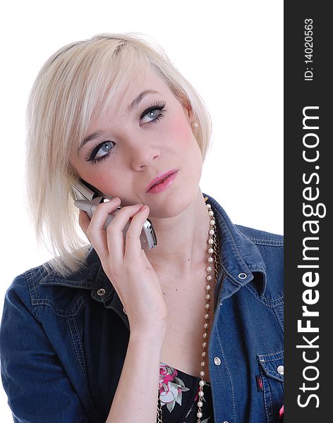 Photograph showing pretty blond girl using mobile phone isolated against white. Photograph showing pretty blond girl using mobile phone isolated against white