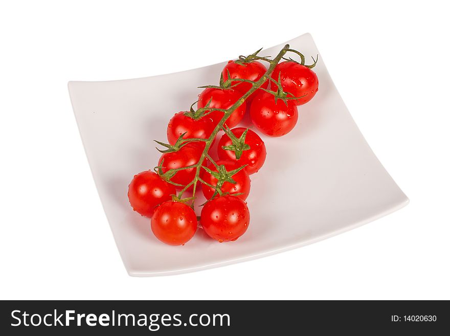 Wet whole tomatos arranged isolated on white