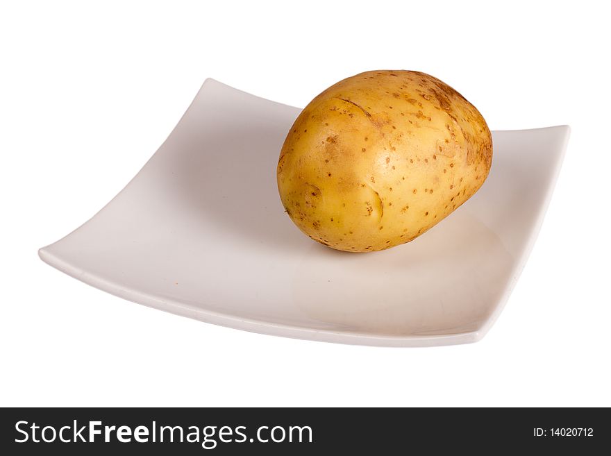 Potato on the plate isolated in white