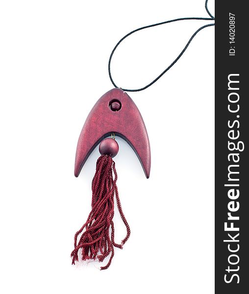 The pendent made of mahogany in the form of fish,isolated white background