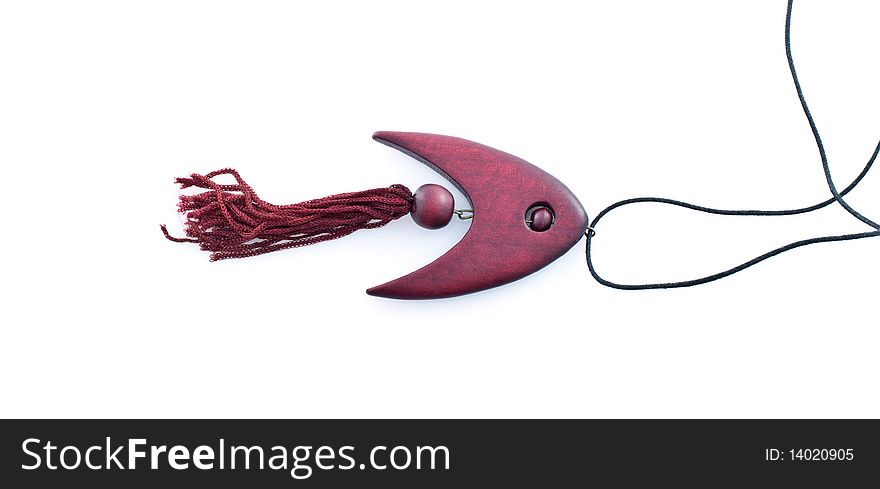 The pendent made of mahogany in the form of fish,isolated white background