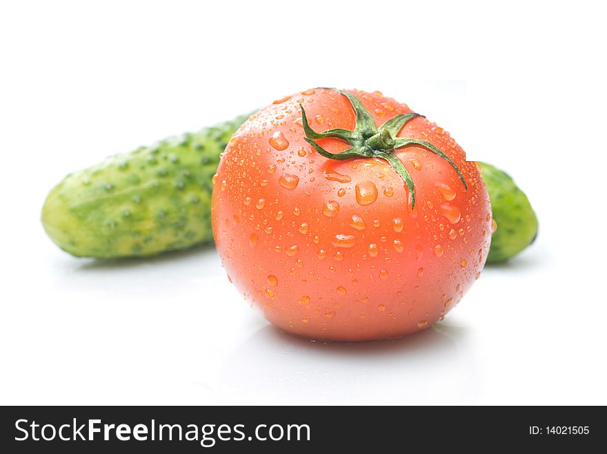 Red Tomato And Green Cucumber With Water Drops