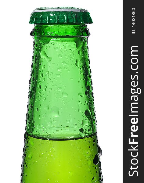 Green beer bottle with water drops isolated on white