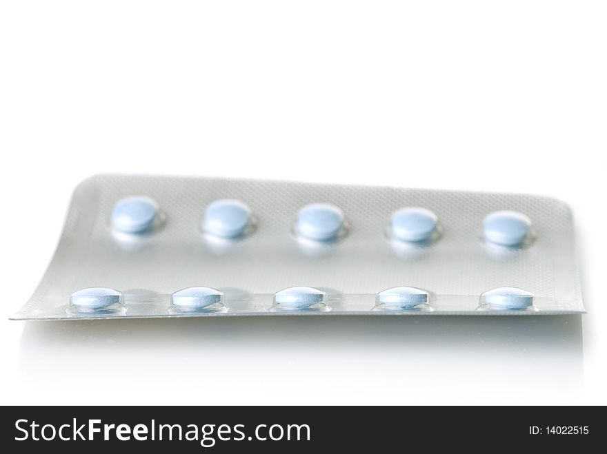 Pack of blue tablets isolated