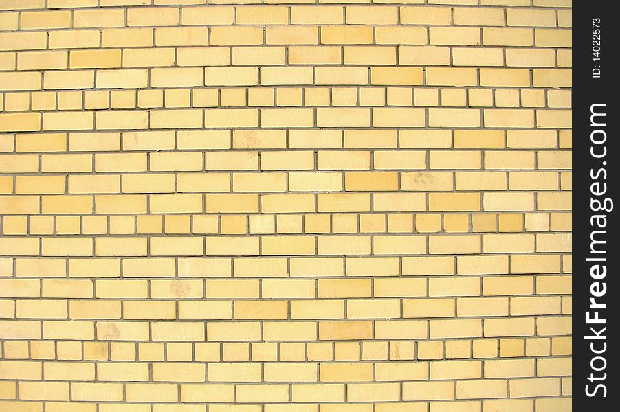 Background. Wall from yellow facing bricks. Background. Wall from yellow facing bricks.