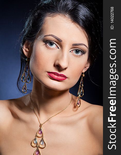 Portrait of elegant beautiful woman wearing jewelry.