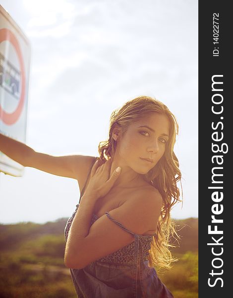 Blond Woman With Road Sign