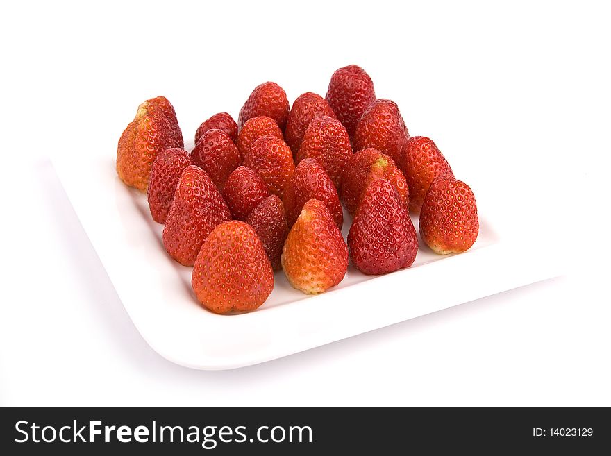 Strawberries on a plate isolated with white background