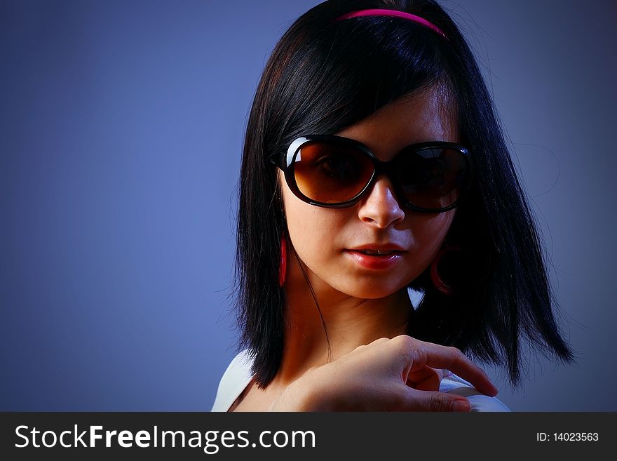 Sexy young woman dancing with sunglasses. Sexy young woman dancing with sunglasses