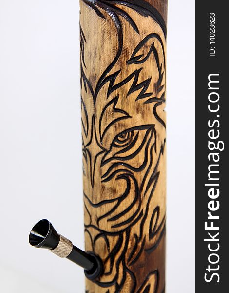 Tiger hand crafted bamboo bong. Tobacco bamboo water pipe. close up. Tiger hand crafted bamboo bong. Tobacco bamboo water pipe. close up