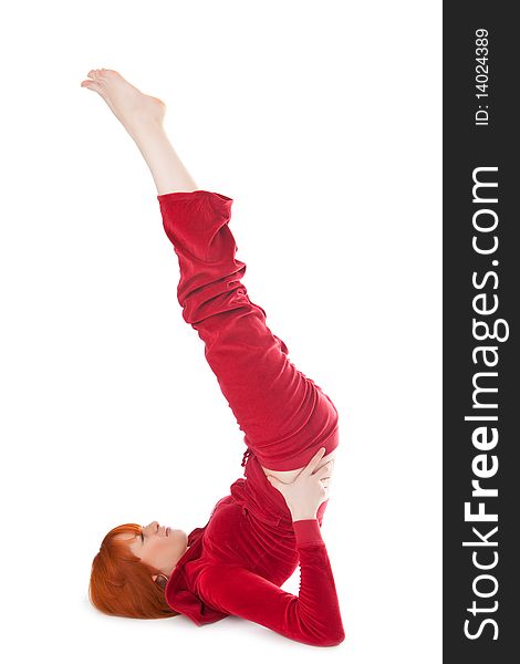 Beautiful girl does exercises on a white background